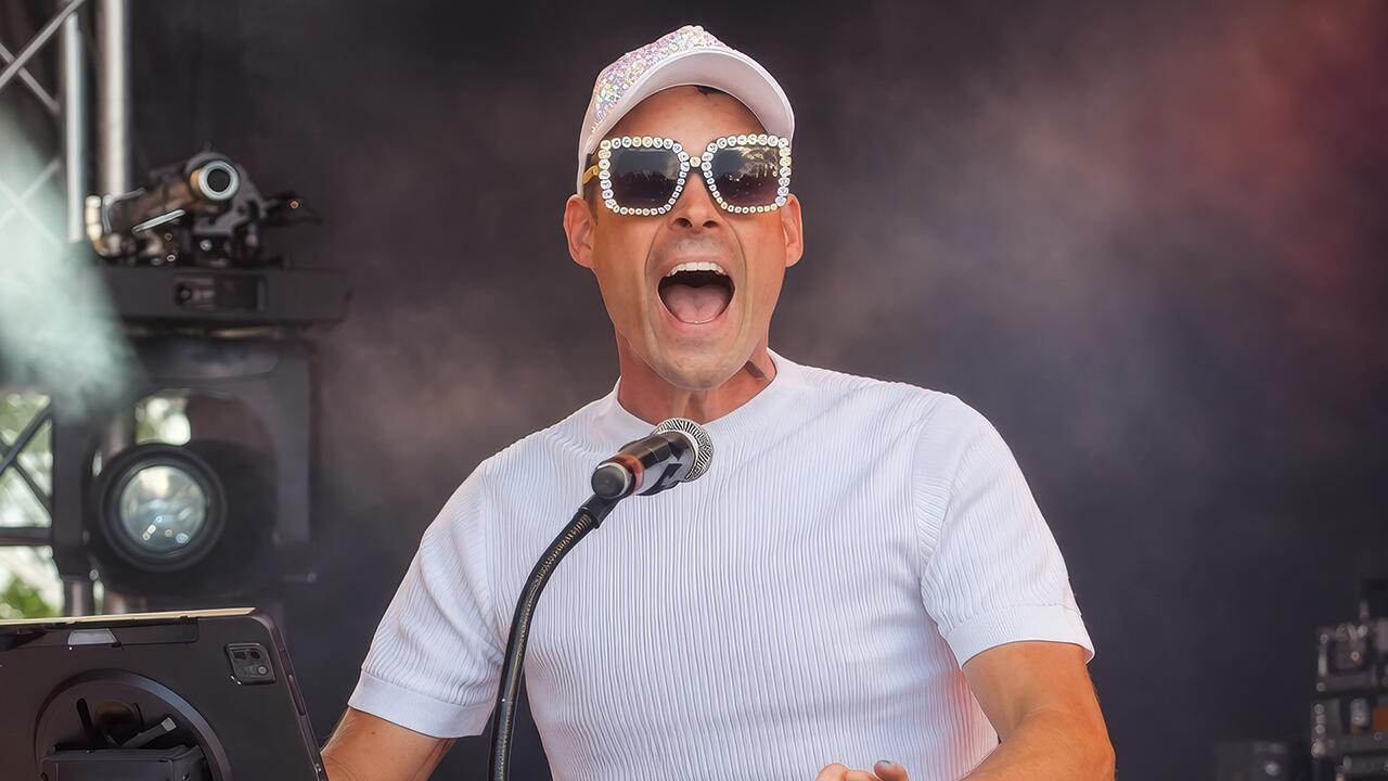 Closeup of Carl Williams singing an Elton John song at the piano