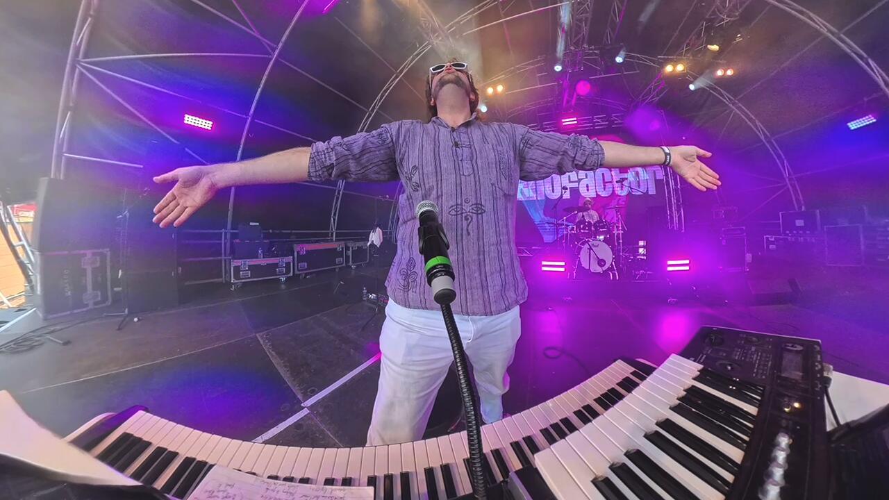 Piano entertainer performing with microphone and keyboard at a live event