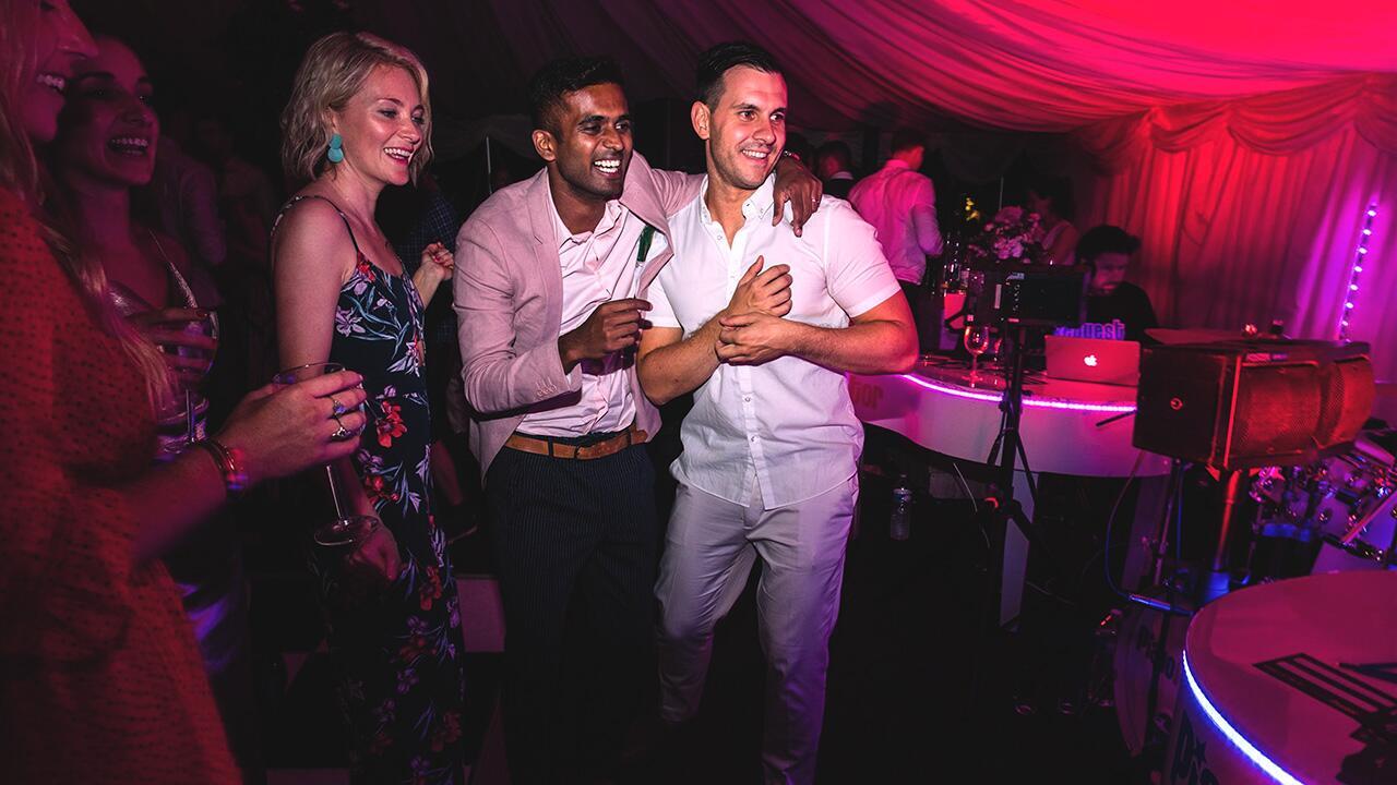 Piano entertainer engaging wedding guests in a singalong during a live performance