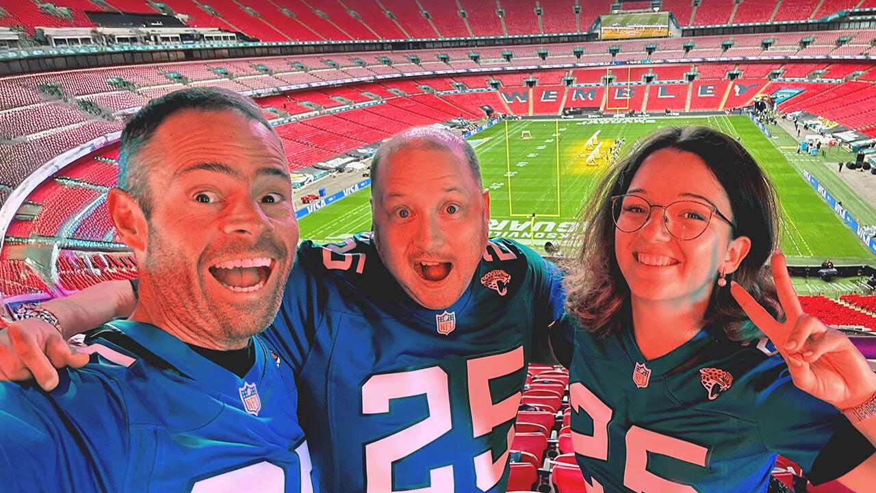 Duelling pianos performers on stage at Wembley Stadium with large audience during live event