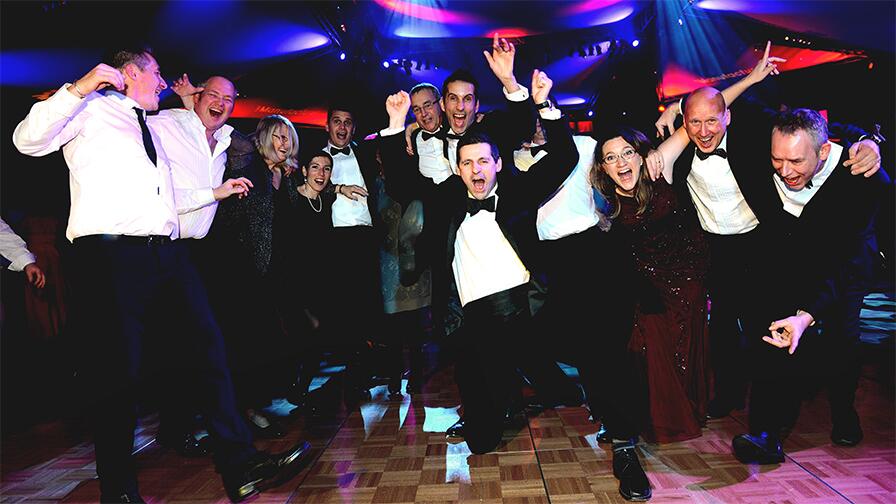 Duelling pianos entertainers performing live at a business event